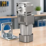 Right-angle AC gear motor with 90-degree output gearbox and mounting bracket on a workshop bench